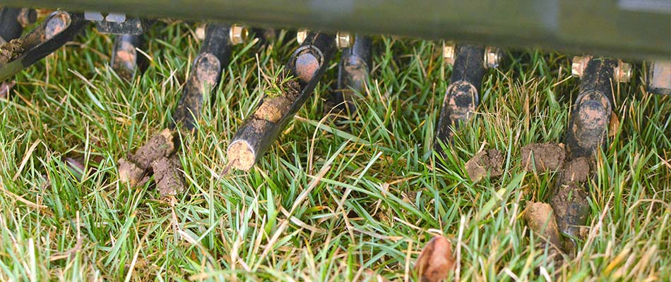 A close up of core aeration equipment on a lawn in Crestline, OH.